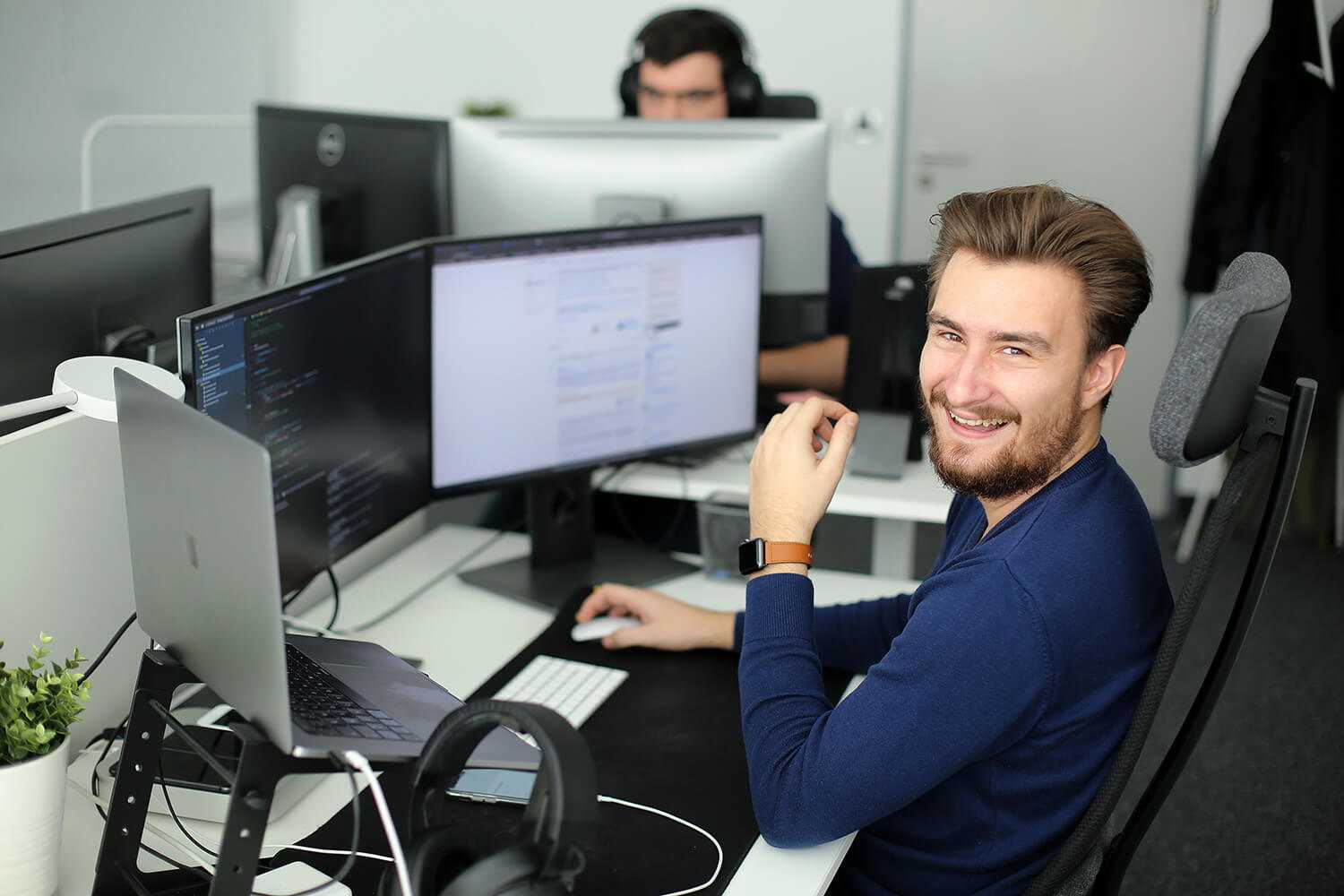 Smiling man on computer